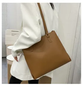 Stylish large capacity brown leather shoulder tote bag for women, perfect for daily commuting.