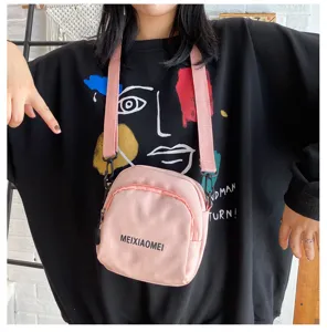 Korean style canvas crossbody bag for women, cute pink shoulder bag with zipper and strap.