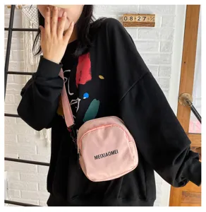 Pink canvas crossbody bag for women, stylish small square shoulder bag with strap.