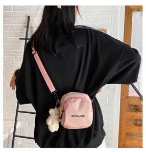 Korean style canvas crossbody bag for women, cute pink shoulder bag with bear pendant.