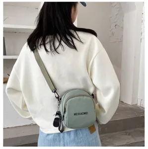 Korean style canvas crossbody bag for women, fashion casual shoulder bag with adjustable strap.