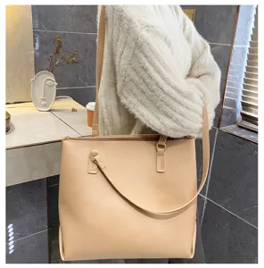 Detailed view of a chic beige women's shoulder tote bag, large capacity and stylish design.
