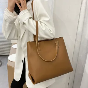 Brown large capacity leather tote bag for women, stylish single shoulder handbag for daily use.