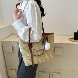 Stylish straw tote bag for women, large capacity summer shoulder bag with cute fluffy ball.