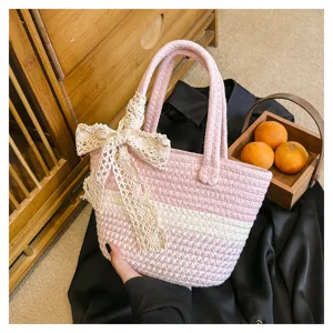 Pink woven contrast tote bag with elegant lace bow detail, large capacity summer shoulder bag.