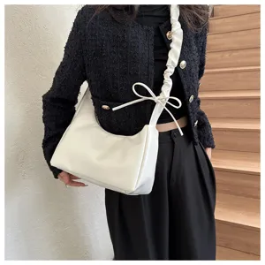 White pleated shoulder bag detail, stylish hobo underarm purse with cute bow tie accent.