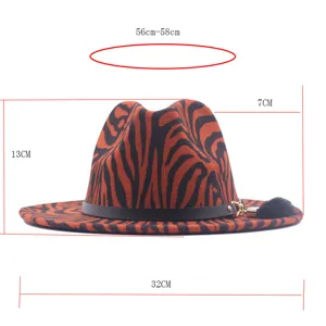 Detailed view of the stylish striped fedora hat with a black belt and chic golden chain tassel.