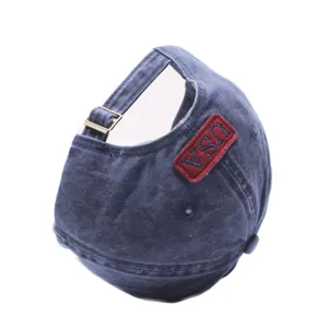 Detail view of the vintage washed cotton baseball cap with USA embroidered patch.