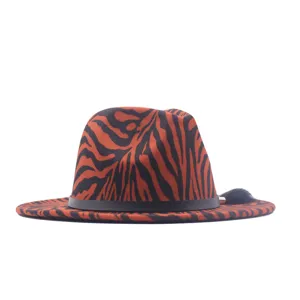 Close-up detail of the orange black striped fedora hat showcasing its unique texture and leather band.