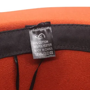 Detailed view of the inner wash label showing material composition for winter fedora hat.