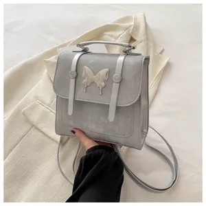 Silver grey backpack messenger bag for women stylish small school bag with butterfly decor detail