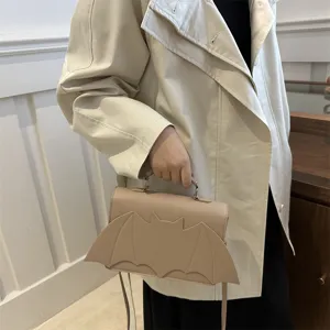 Women's chic bat wing shoulder bag, stylish beige crossbody handbag for daily casual wear.