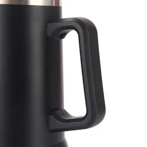 Stainless steel vacuum insulated mug detail view, black finish and ergonomic handle.