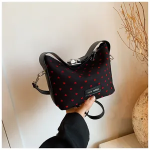Women fashion casual shoulder crossbody bag with cute red heart print and top handle design.