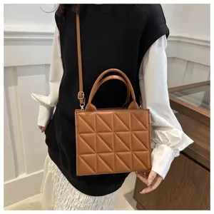 Brown quilted triangle pattern shoulder crossbody handbag detail view, stylish PU leather bag.