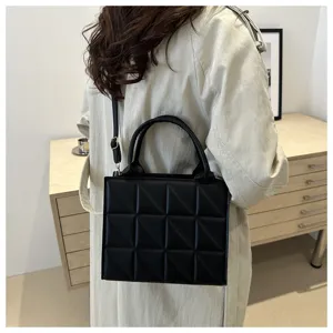 Black quilted small square bag women Korean fashion shoulder crossbody handbag detail view.