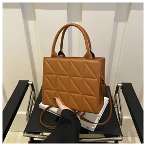 Chic brown quilted tote bag for women, stylish PU leather shoulder and crossbody handbag.