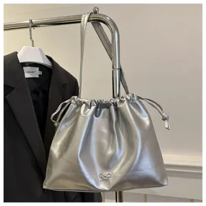 Stylish metallic soft leather shoulder bucket bag with drawstring and cute bow detail.