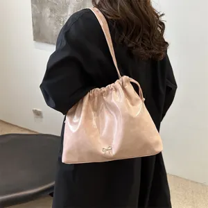 Chic soft leather shoulder bag for women, stylish daily commuting handbag with drawstring.