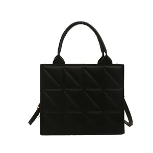 Black quilted square crossbody bag, stylish top handle tote purse for women daily use.