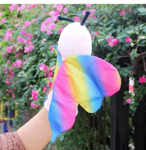 Detailed shot of colorful rainbow butterfly plush hand puppet, soft toy for kids play.