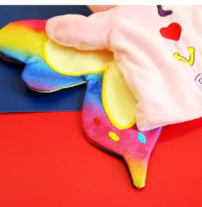 Close-up detail of cute butterfly hand puppet plush toy with soft embroidered accents.