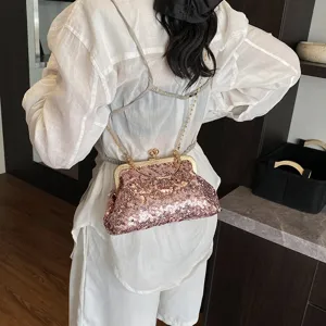 Chic pink sequin women's shoulder chain bag, elegant metal kiss-lock crossbody bag fashion.