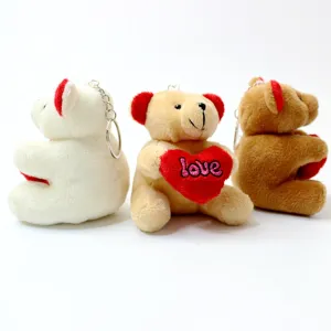 Cute heart-bearing bear plush toy keychain, fluffy animal doll pendant gift for keys.