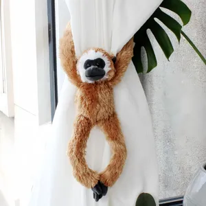 Hanging gibbon plush toy detail, cute monkey curtain tieback, soft stuffed animal decor.