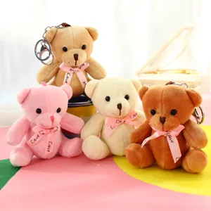 Mignon porte-clés en peluche ours avec nœud, pendentif de sac doux et décoration de sac à dos.