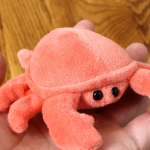 Cute orange plush crab toy, soft stuffed ocean animal doll for kids and fun holiday gifts.