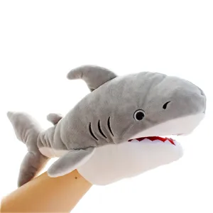 Cute plush shark hand puppet for kids storytelling and parent-child interactive games.