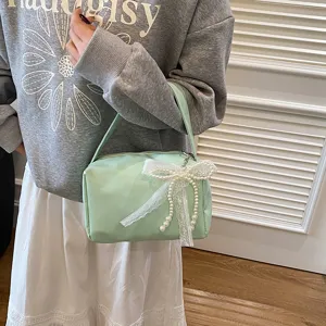 Mint green shoulder handbag with elegant lace pearl bow, stylish commuter underarm bag for women.