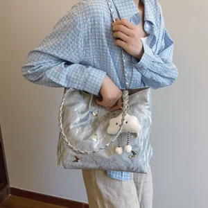 Silver metallic tote bag for women, large capacity shoulder handbag with cute butterfly and cloud charms.