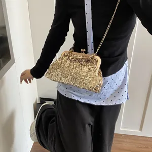 Stylish gold sequin kiss-lock shoulder bag for women, chic chain crossbody bag main view.