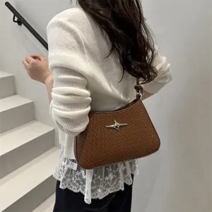 Stylish woven underarm shoulder bag for women, featuring trendy brown leather and chic clasp.