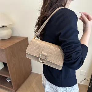 Minimalist beige shoulder bag for women, chic stone pattern baguette bag with gold buckle.