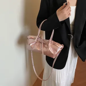 Trendy metallic pink shoulder bag for women, chic bow knot tote and casual crossbody purse.