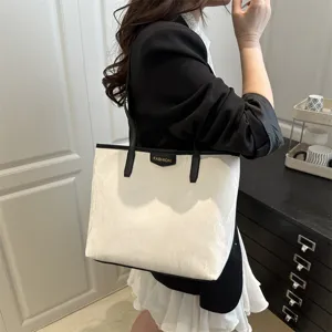 Stylish large capacity women tote bag, elegant commuter shoulder bag for daily work use.