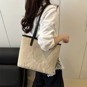 Large capacity beige commuter tote bag for women, versatile PU leather shoulder handbag.