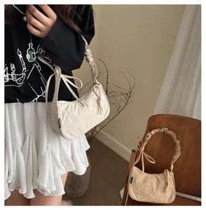 Stylish casual canvas shoulder bag with ruched handle and drawstring detail for daily commute.