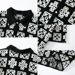 Detailed view of black and white contrast crochet hollow knit polo shirt collar and cuff design
