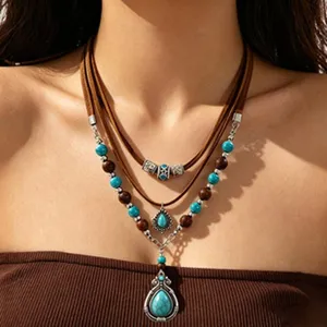 Bohemian multi-layer leather necklace with turquoise beads and retro silver pendants.