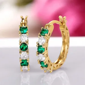 Gold-plated U-shaped hoop earrings featuring alternating green and white cubic zirconia stones.