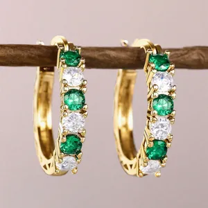 Gold-plated U-shaped hoop earrings featuring alternating green and clear round cubic zirconia.