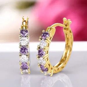 Elegant gold plated U-shaped hoop earrings featuring alternating purple and white cubic zirconia stones.