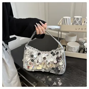 Silver sequin underarm bag detail featuring sparkly sequins and chic chain for trendy style.