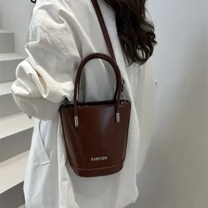 Korean style solid color leather bucket bag, fashionable women shoulder handbag for daily use.