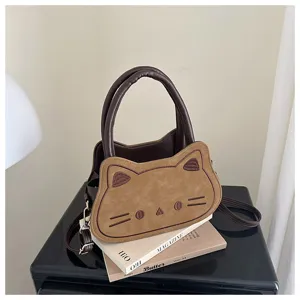 Cute brown cat shaped shoulder bag detail view, showing exquisite embroidery and suede fabric texture.