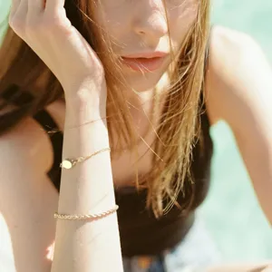 Minimalist metal bracelet featuring a round magnetic clasp, perfect for DIY jewelry crafting.